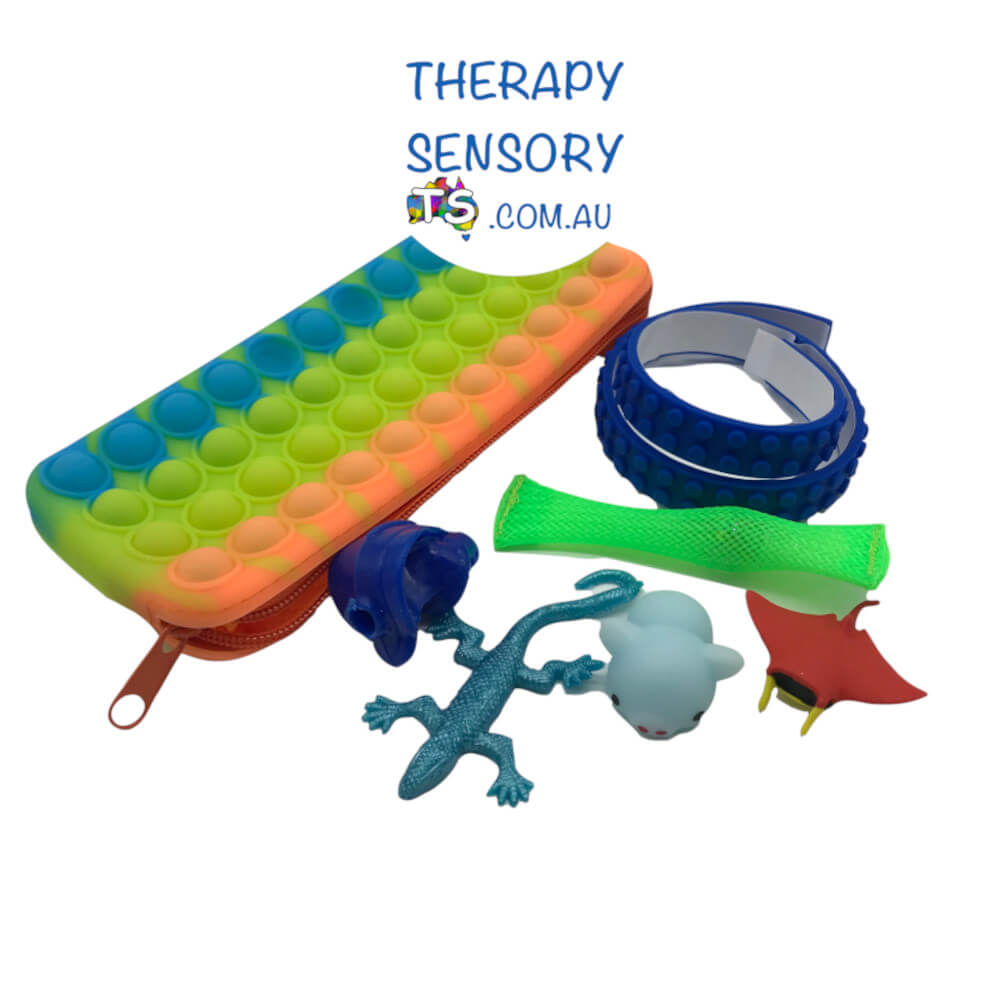 Ultimate Classroom Fidget Case kit from TherapySensory.com.au displays 1 x Squish Moshi Friend, 1 x 45cm strip of Adhesive textured strip, 1 x Grotto grip, 1 x Collectable Rubber, 1 x Marble Fidget, 1 x Mini stretch toy. Colours and versions of products