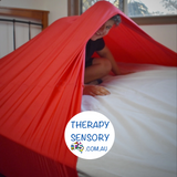 Lycra bed sock from TherapySensory.com.au displays a sheet that wraps around the whole bed to provide resistance to the sleeper.