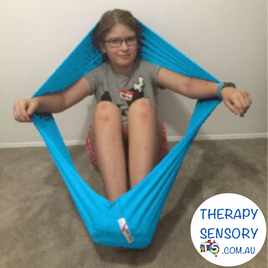 Lycra resistance band from TherapySensory.com.au displays a piece of lycra shaped like an elastic band that you climb into and stretch out.
