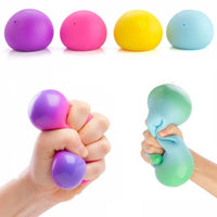 Colour change ball, jumbo and small being squeezed by hands.