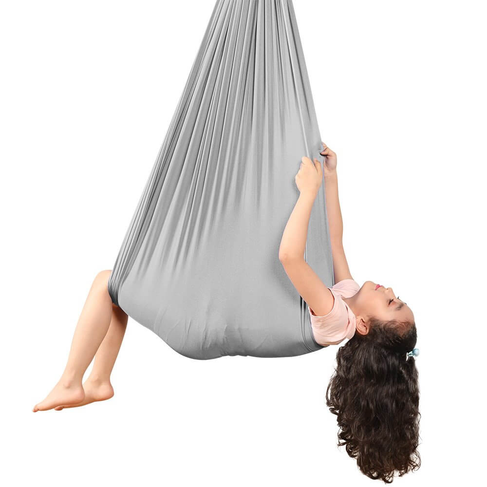 Kids Elastic Yoga Sensory Hammock Swing with a child sitting inside it.